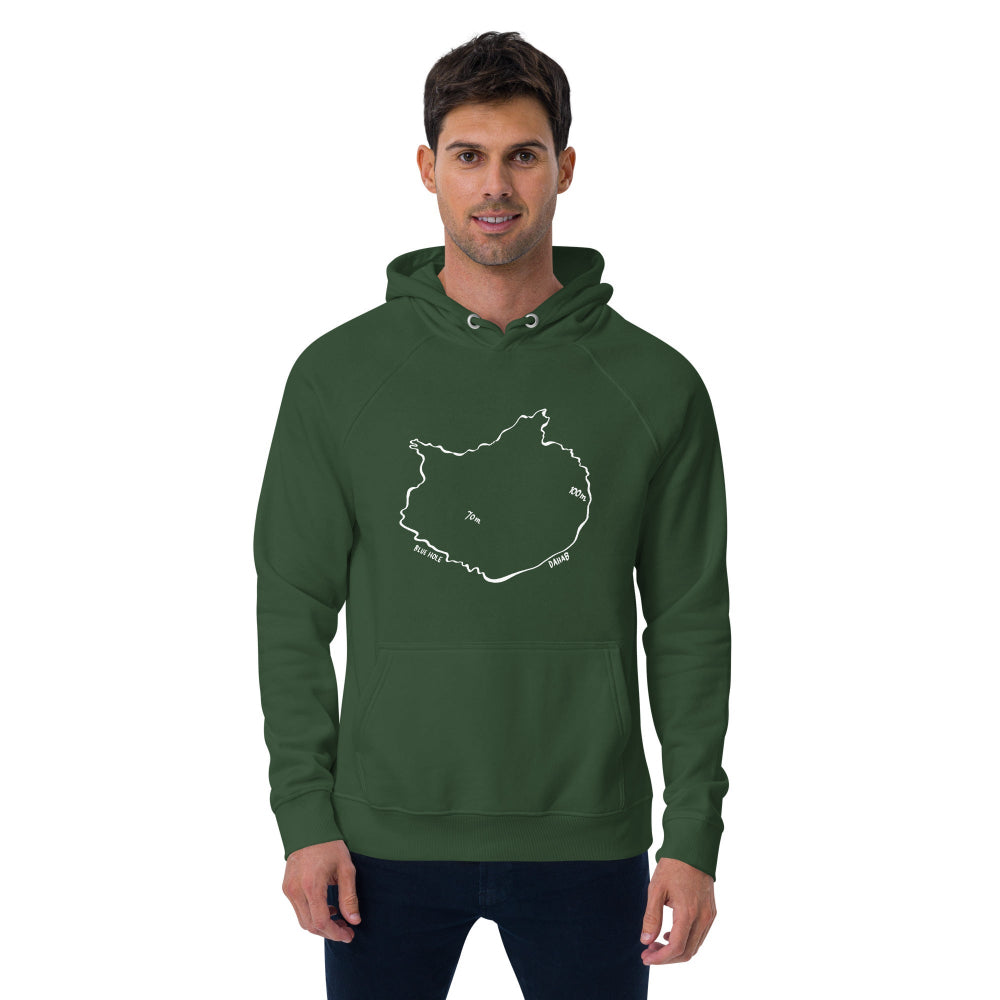 A man wearing the Blue Hole Eco Hoodie in green, inspired by Dahab and freediving culture