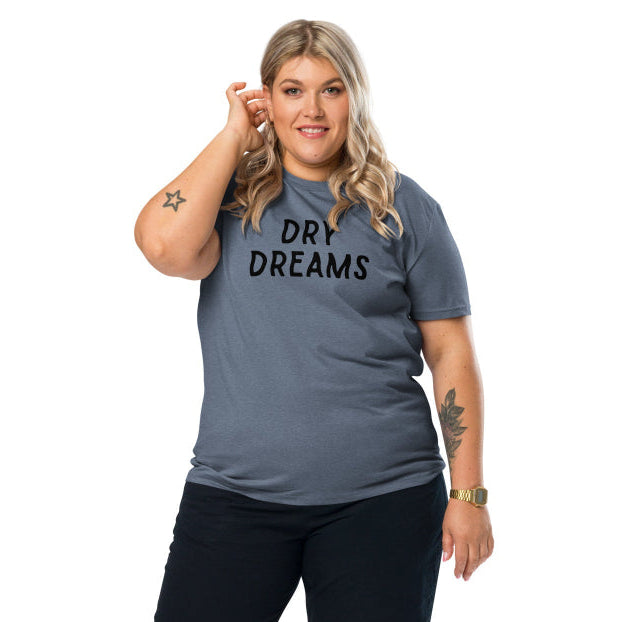 A woman wearing a blue Dry Dreams organic unisex T-shirt in an oversized fit, front view