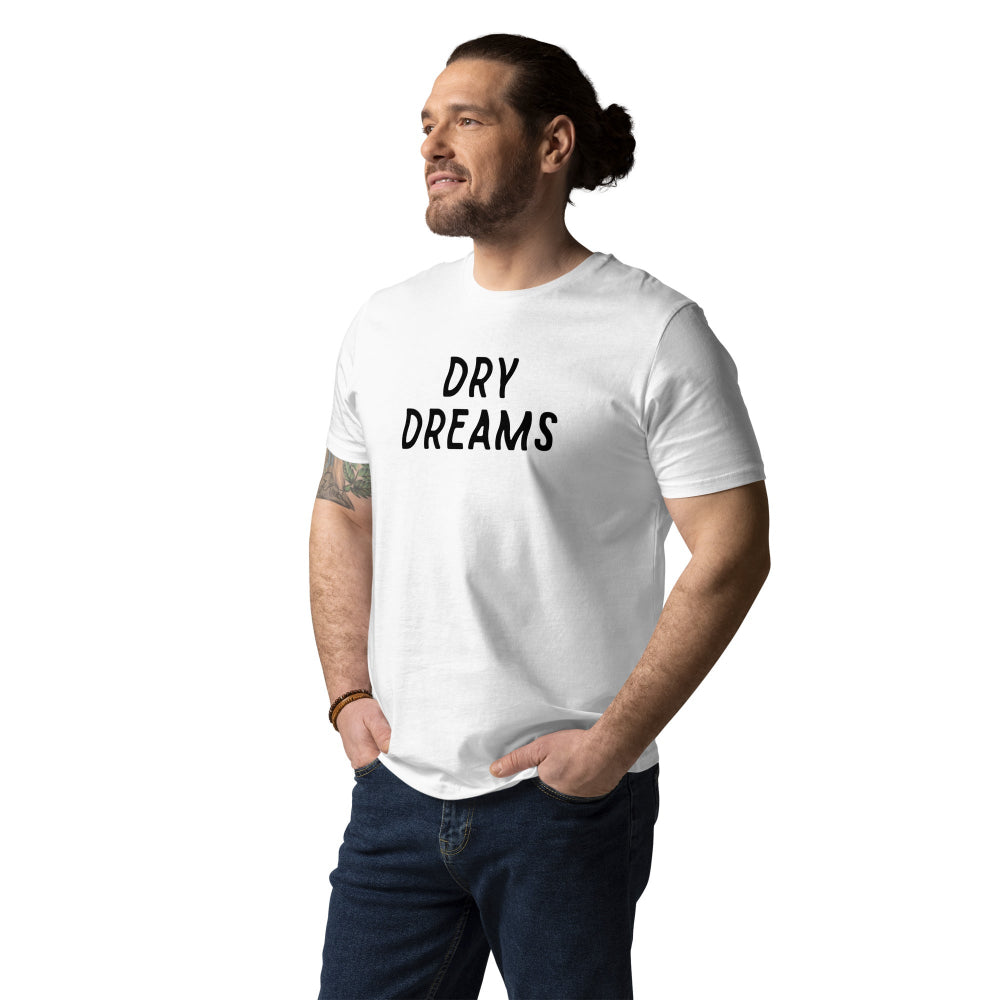 A person wearing a white crew neck T-shirt with the text 'DRY DREAMS' on the front.