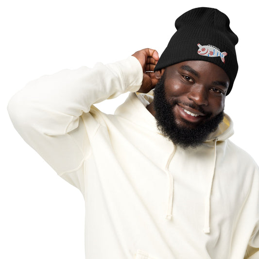 A man wearing a black Fishful Thinking organic ribbed beanie with embroidered unicornfish