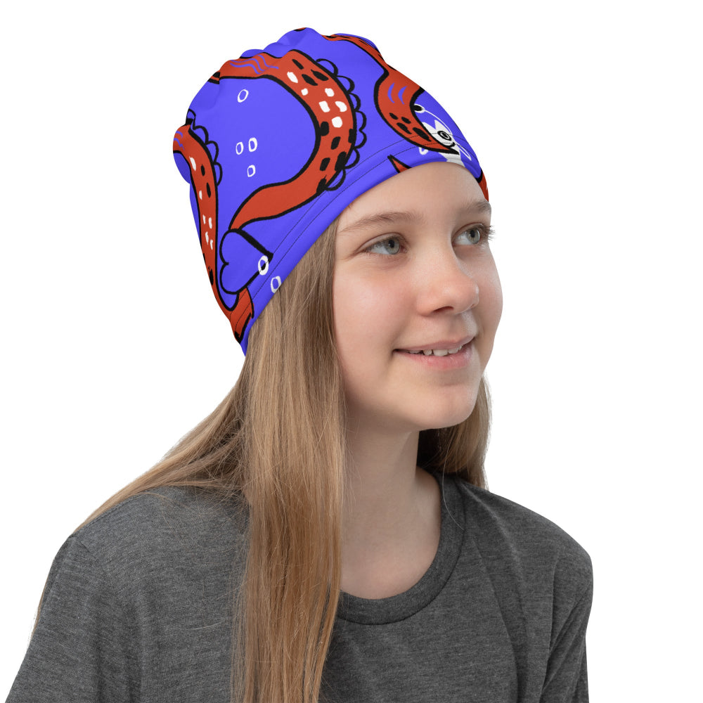 A young girl wearing the Octopus Buff folded into a hat