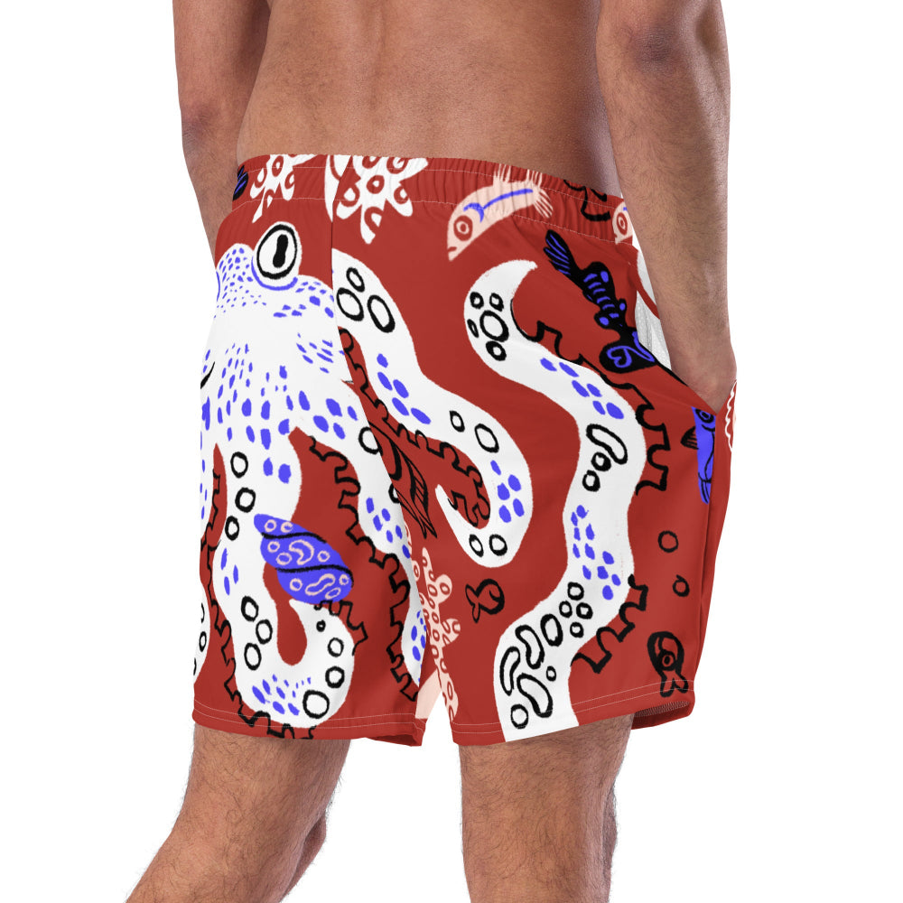 Cropped back angled view of a person wearing Octopuses Dry Dream recycled swimming trunks with an octopus illustration on the bottom. 