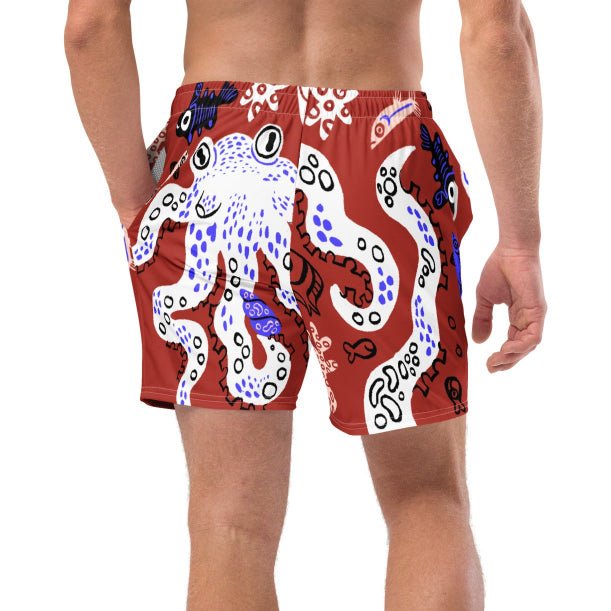 Cropped back view of a person wearing Octopuses Dry Dream recycled swimming trunks with octopus pattern, lower body shown