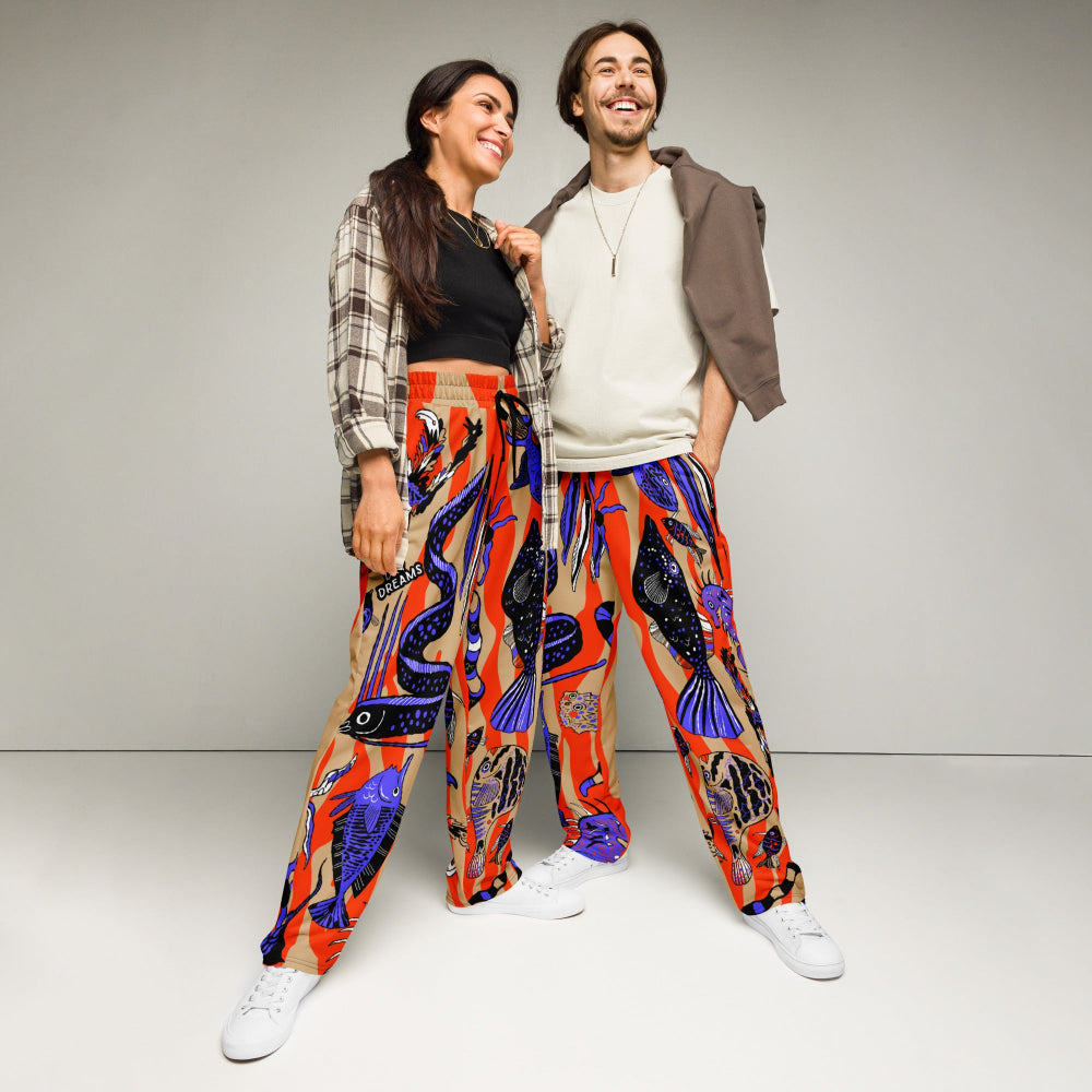 A man and a woman wearing Wild Catch recycled unisex joggers in a casual leisure setting
