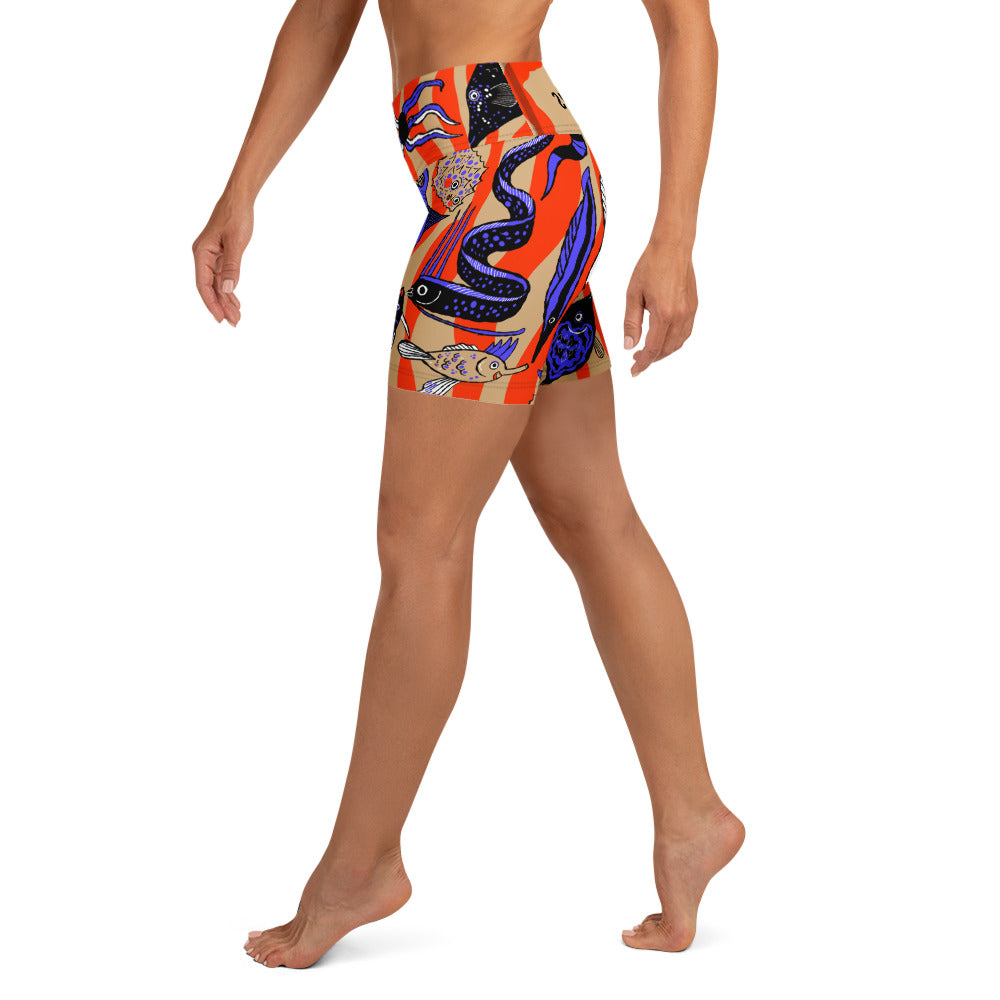 Left side view of the Wild Catch yoga shorts showing the fit and striped fish pattern