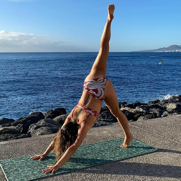 Woman in a yoga position wearing a Dry Dreams Bikini