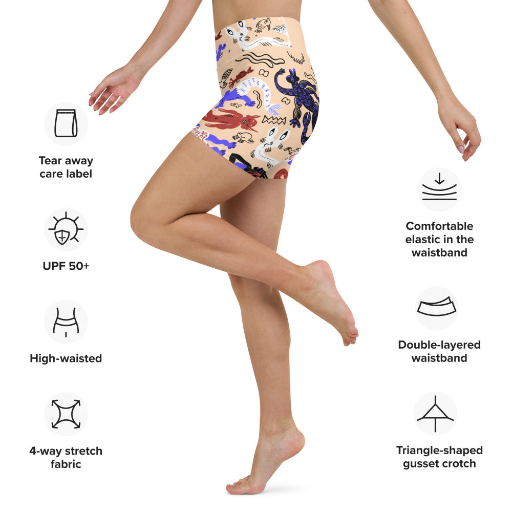 Right side view of a person wearing sand tan Mermaid Frenzy yoga shorts with product feature information displayed