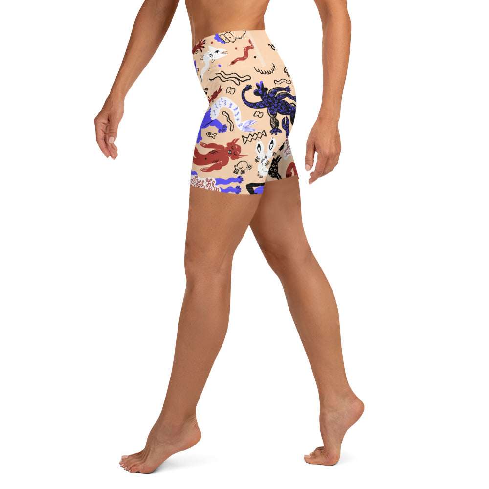 Right side view of a person wearing sand tan Mermaid Frenzy yoga shorts